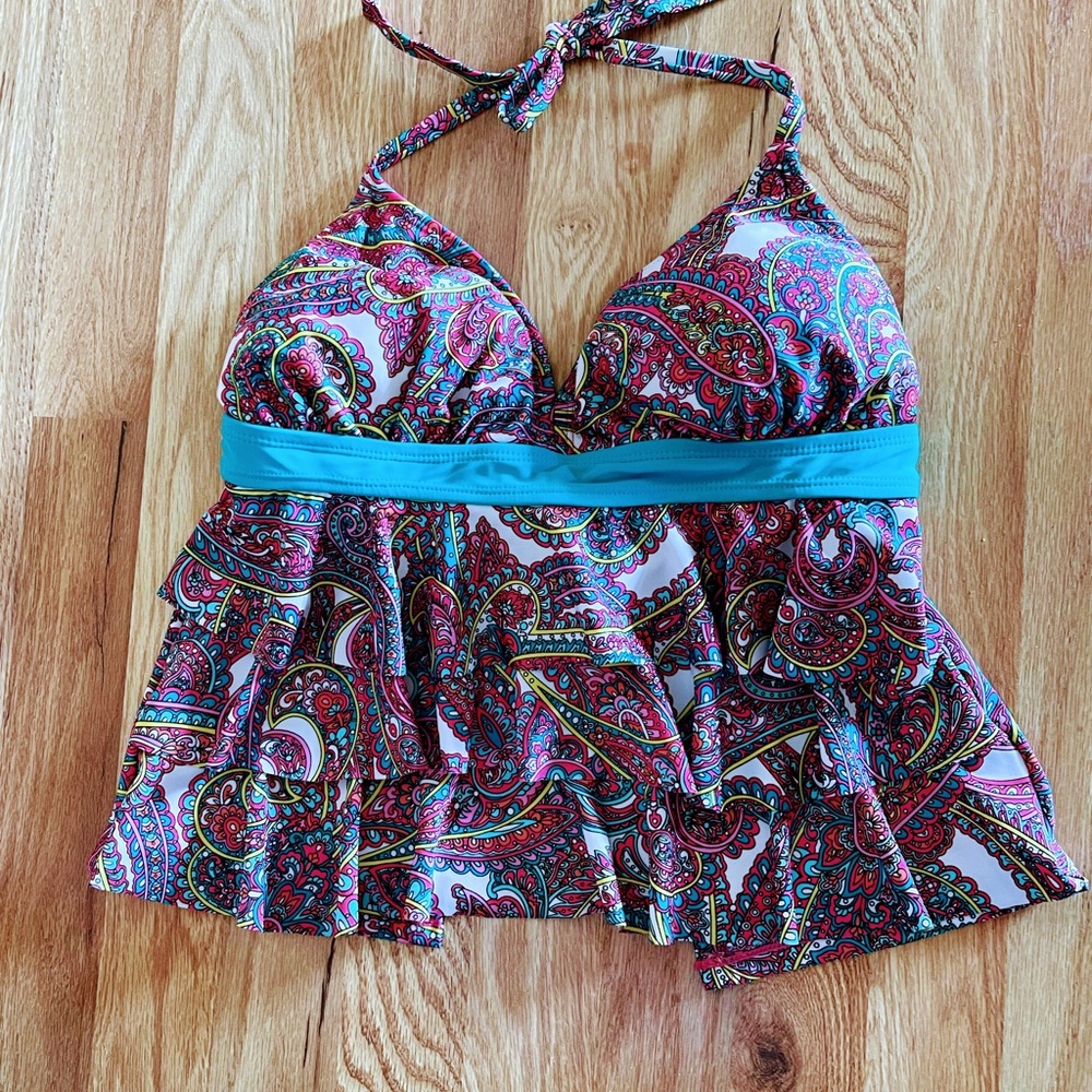 This tankini is hot pink with a turquoise ribbon that wraps around to tie.